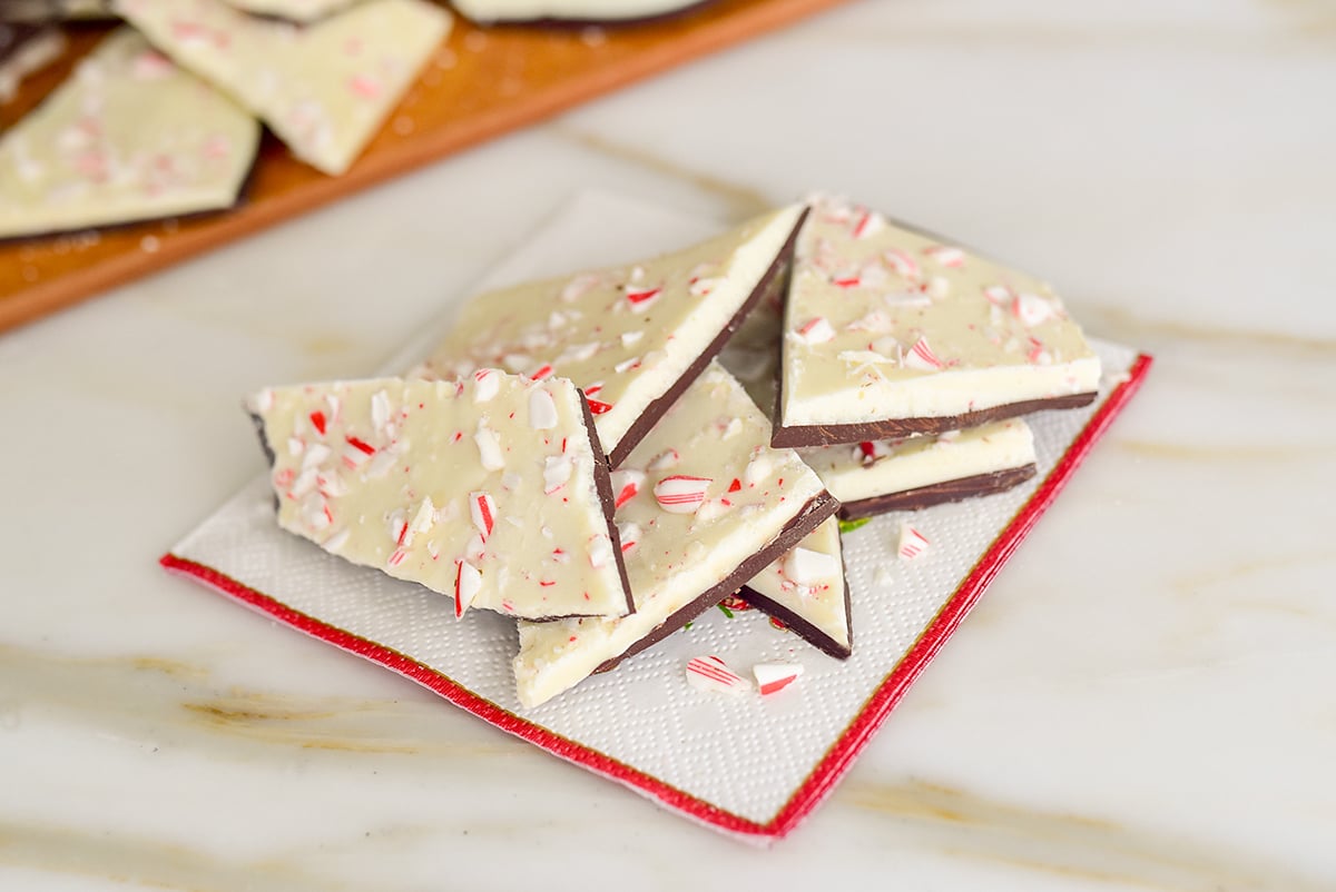 Peppermint bark with white chocolate and crushed candy canes on a red-tipped napkin