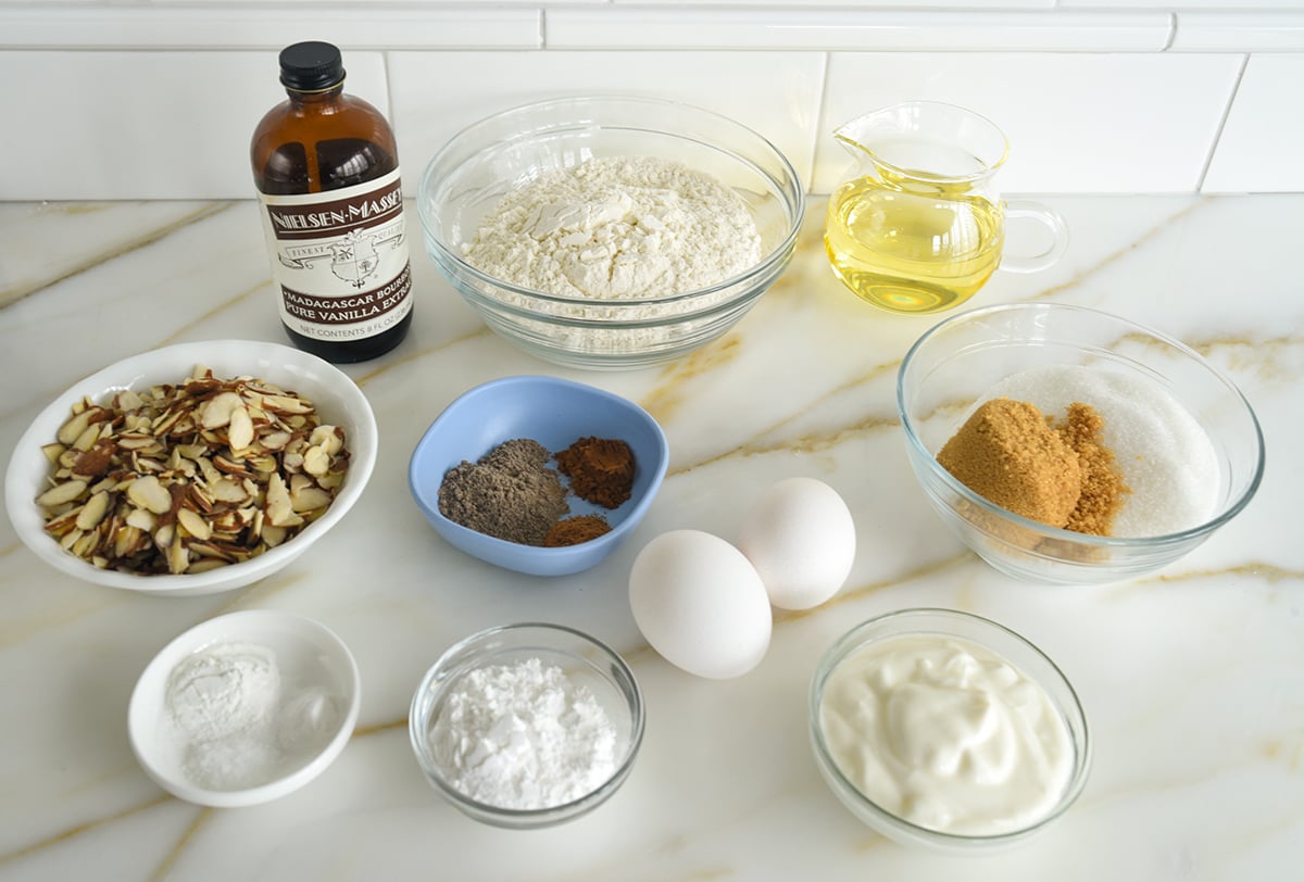 Ingredients for cardamom cake on a marble countertop