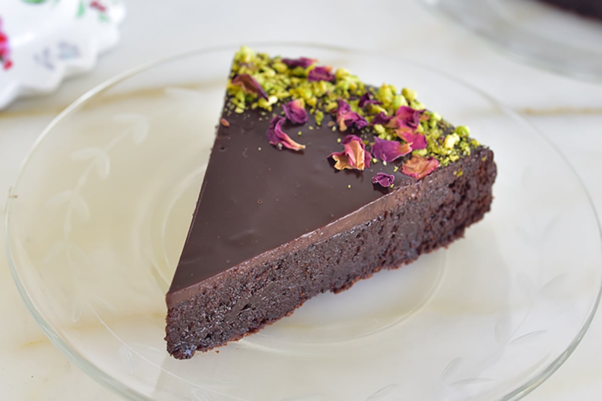 flourless chocolate cake wedge on a plate