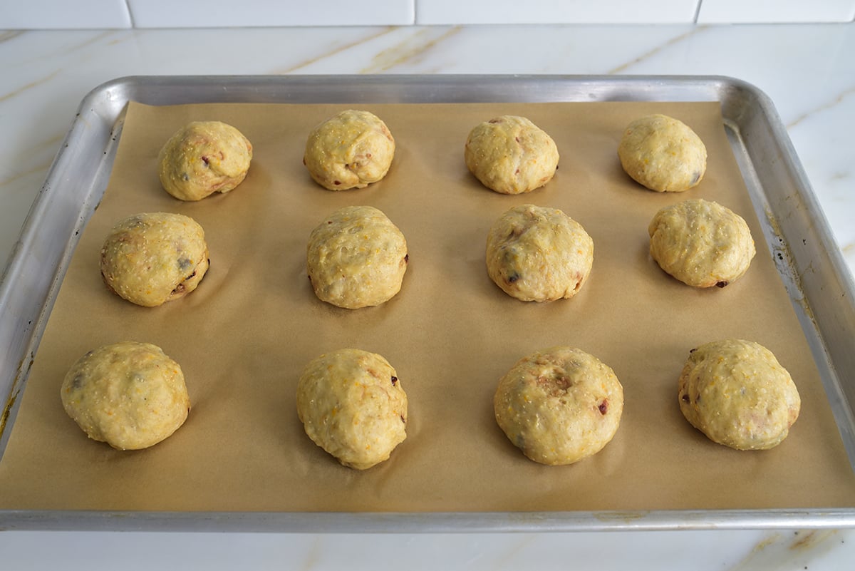 dough balls on a parchment lined baking sheet