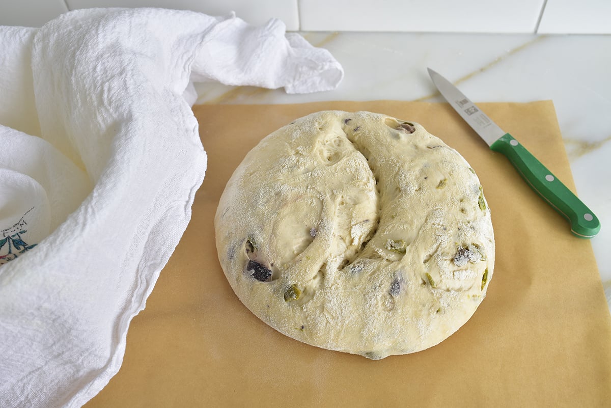 Round dough ball slashed across the top with a knife along the side