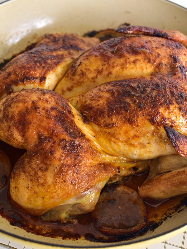 roasted chicken spatchcock style in an enameled pot