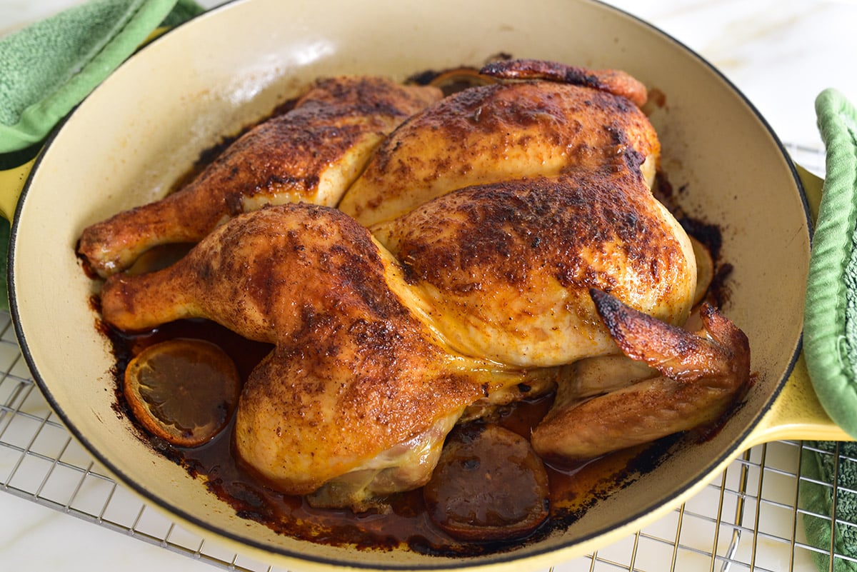 roasted chicken spatchcock style in an enameled pot