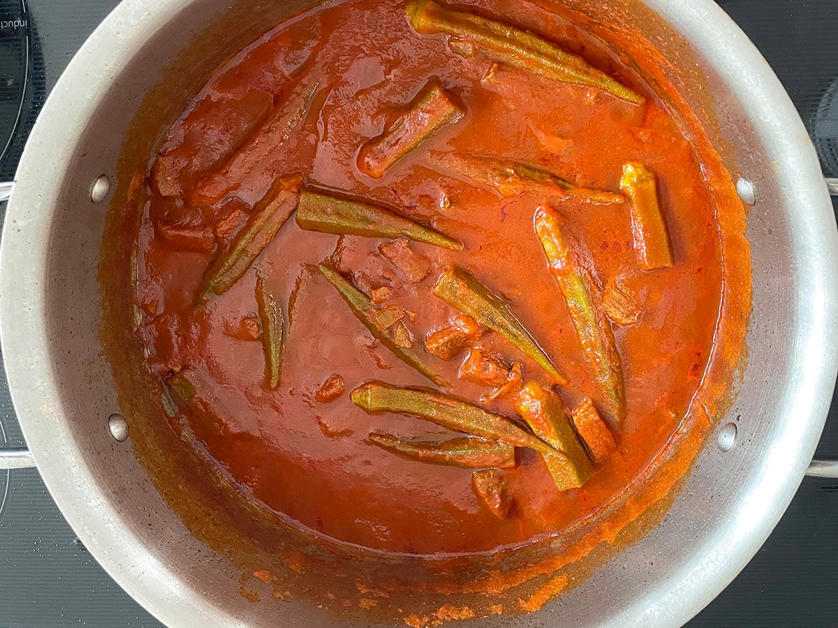 cooked okra in tomato sauce in a pan for bamia