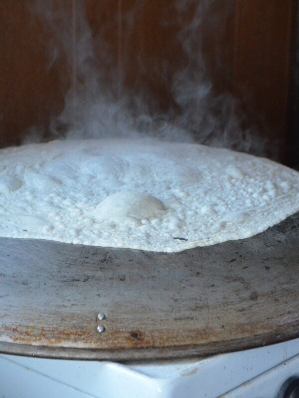 Saj bread baking on a saj oven