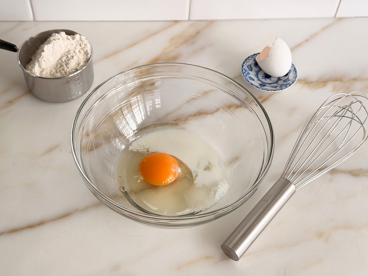 Liquid ingredients in a glass bowl for egg pasta