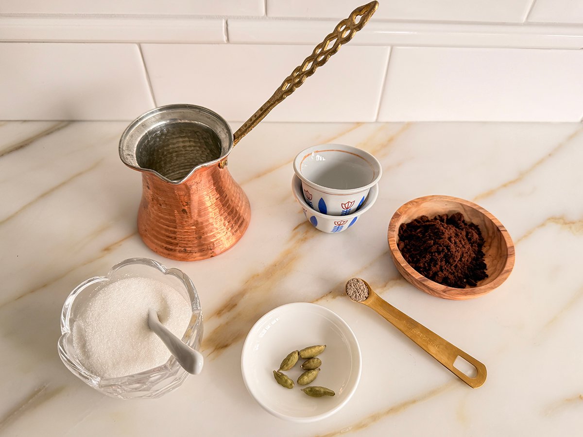 Ingredients for Arabic coffee on a marble countertop