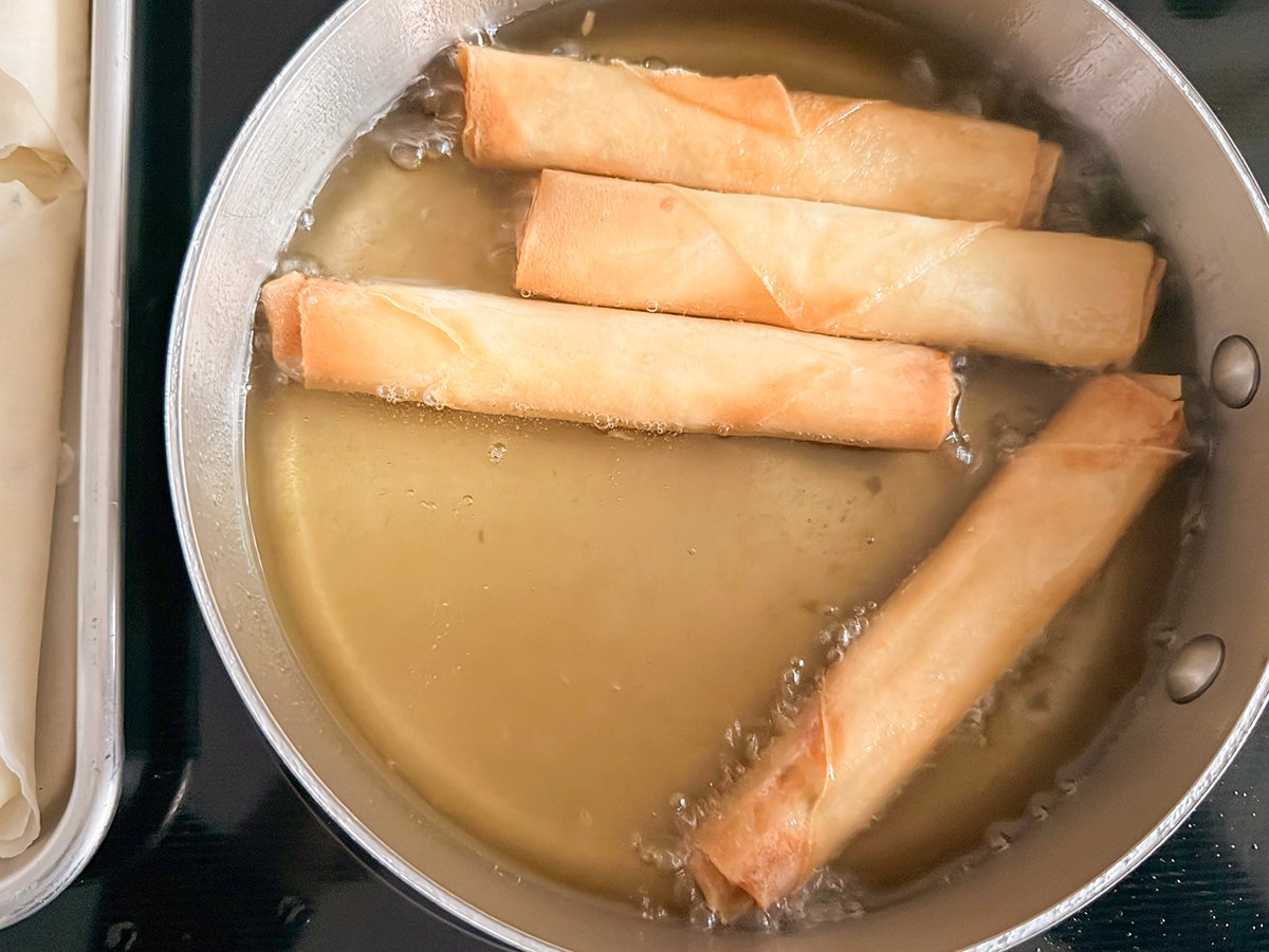 golden rolls finished frying in hot oil