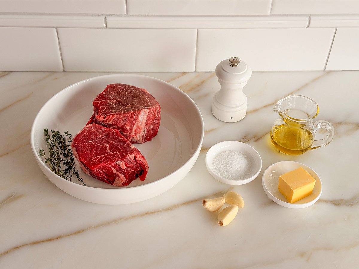 Ingredients for filet mignon on a marble countertop