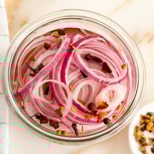 Pickled red onions in a jar with no lid