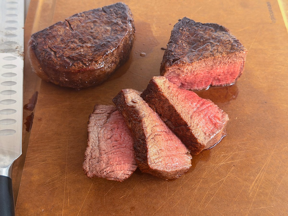 Sliced filet mignon on a cutting board