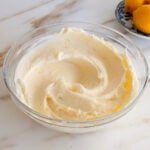 Lemon cream cheese buttercream frosting in a glass bowl