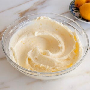 Lemon cream cheese buttercream frosting in a glass bowl