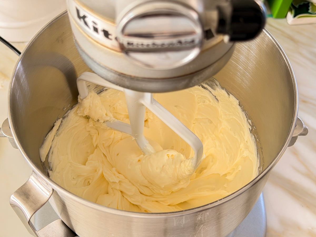 Smooth butter and cream cheese in the bowl of a stand mixer