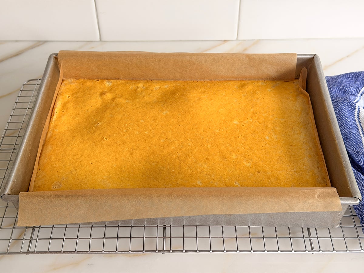 Baked lemon bars in a parchment lined pan