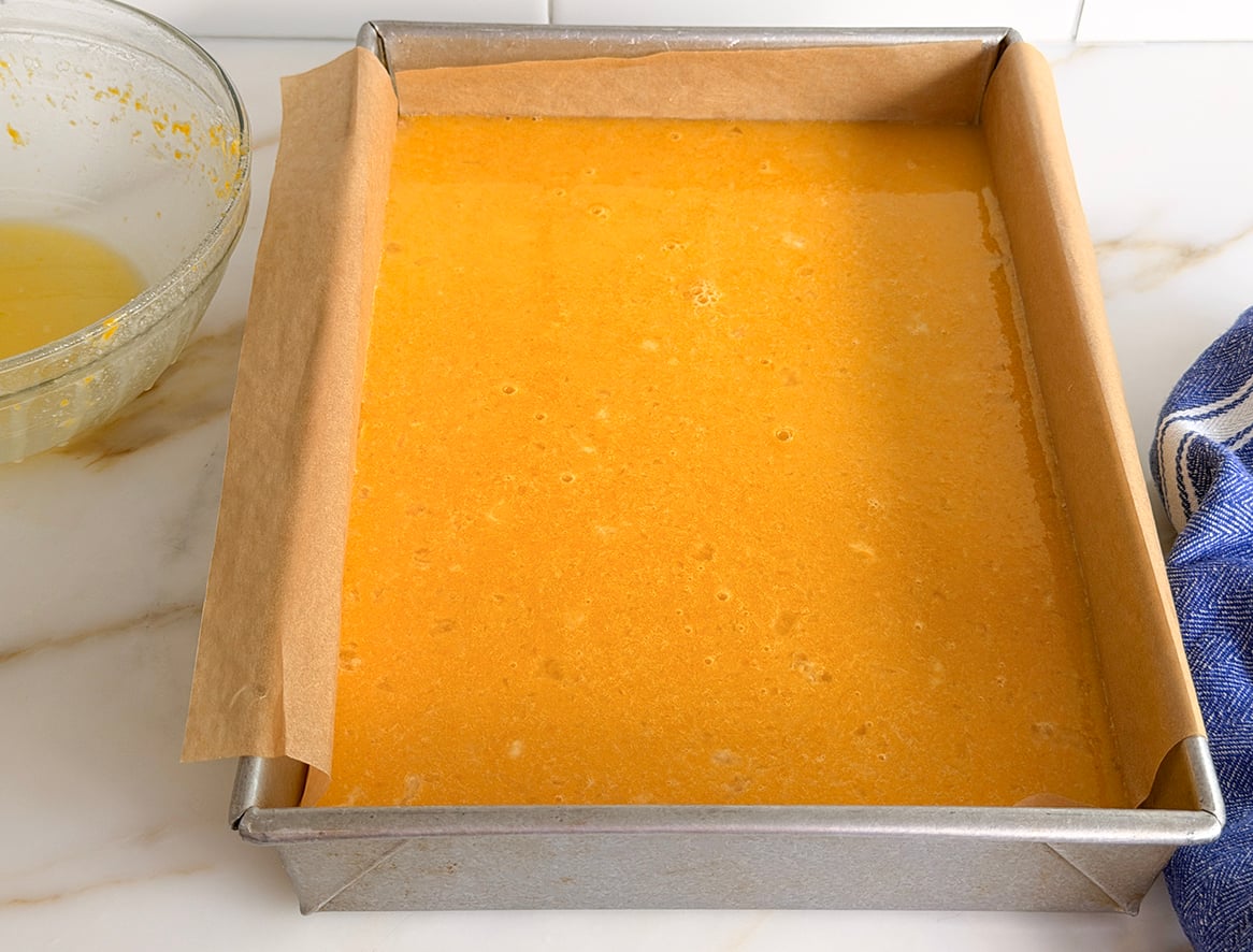 Lemon custard filling in a parchment lined pan