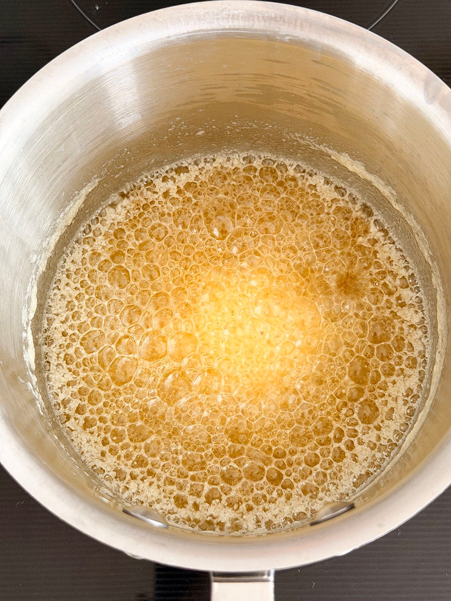 Butter boiling in a steel pot