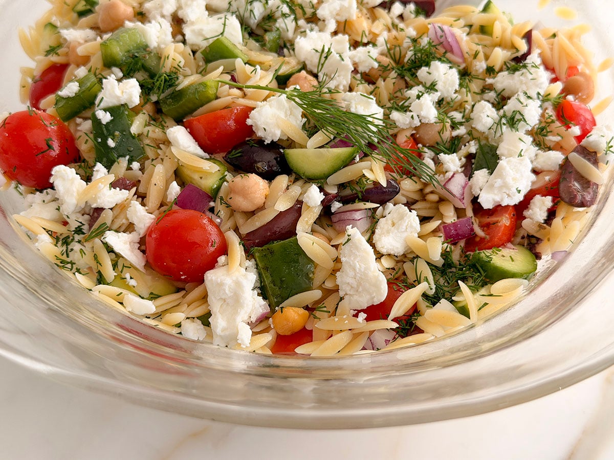 Orzo pasta salad with Greek Salad Dressing on it