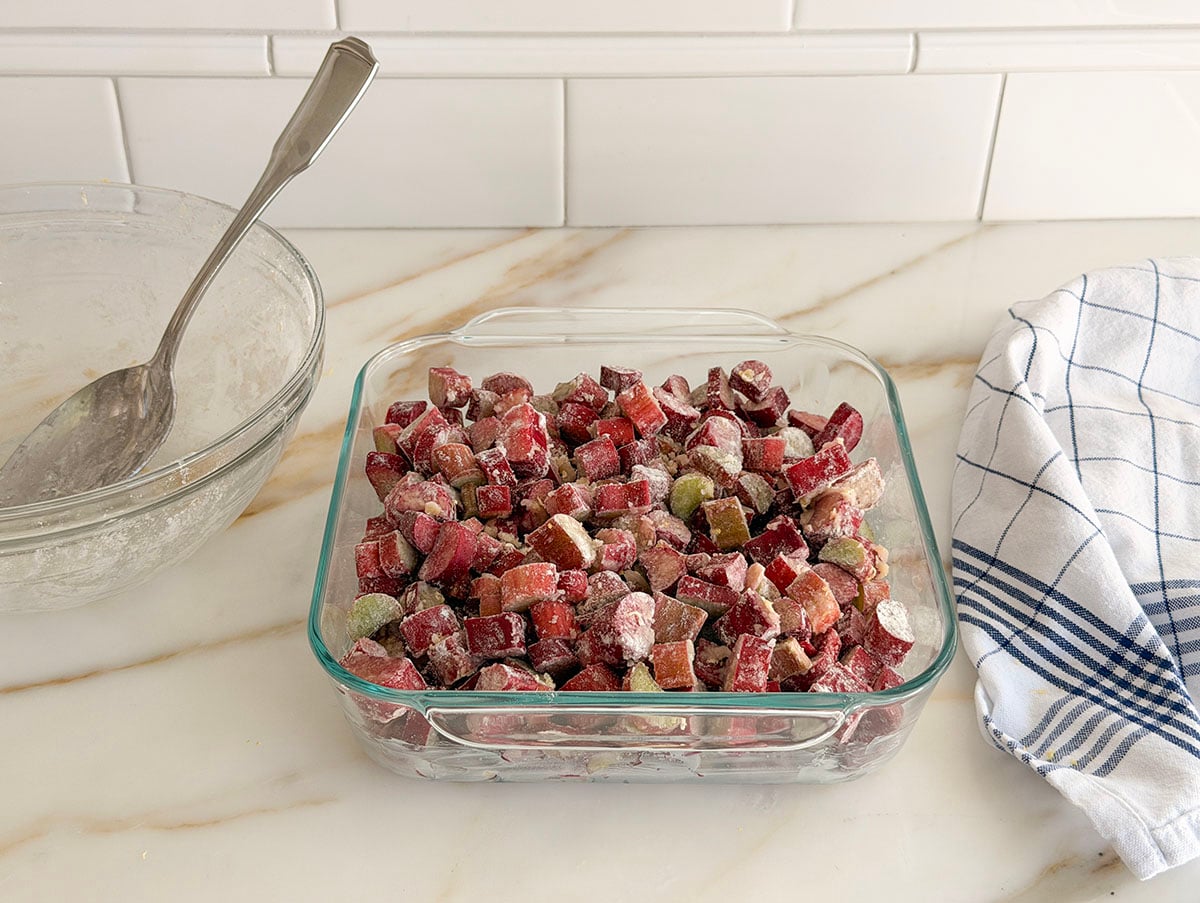 Sugared diced rhubarb in a glass baking dish