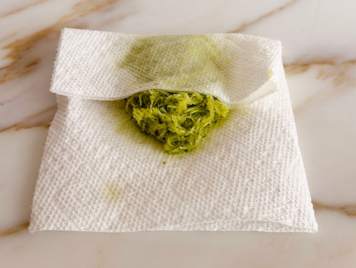 Grated cucumber in white paper towel