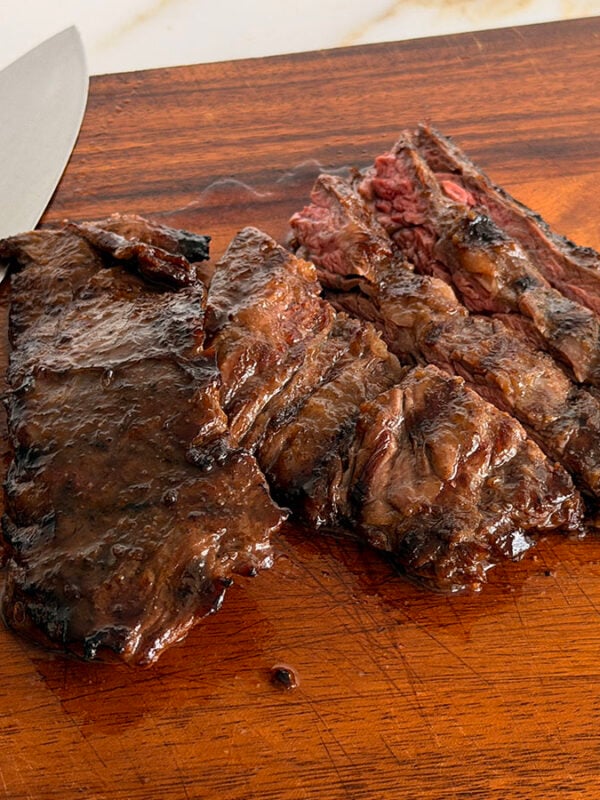 Grilled marinated steak on a cutting board