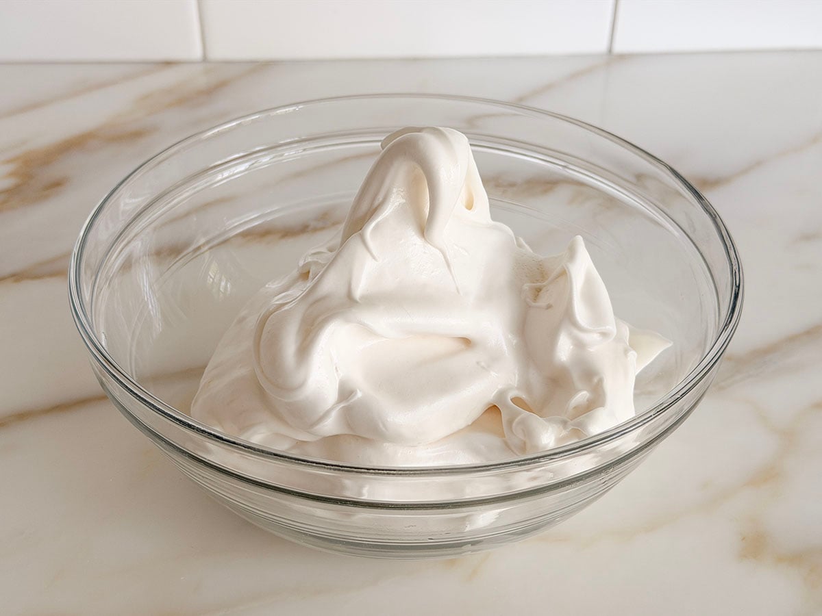 whipped meringue in a glass bowl