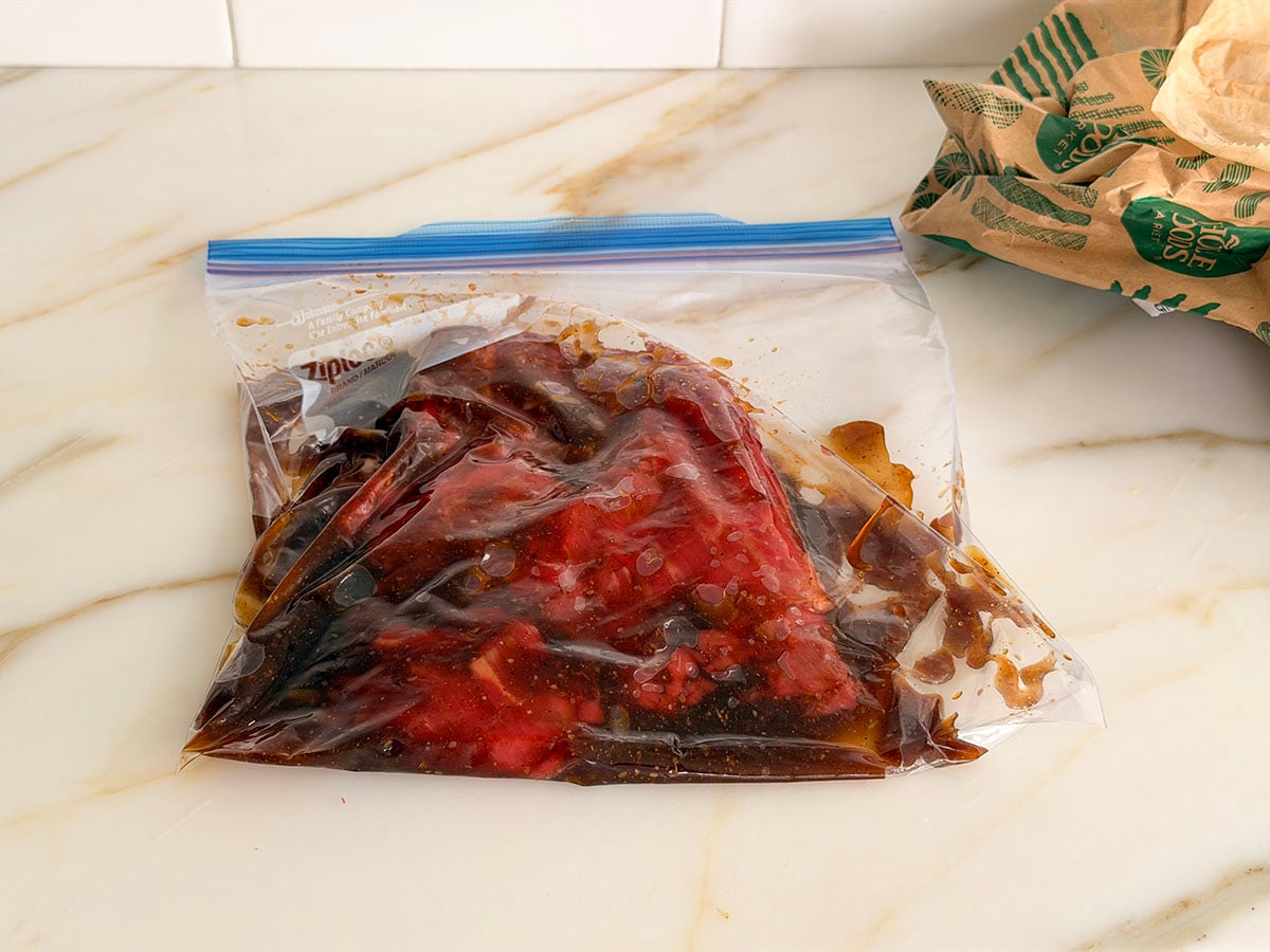 Steak with marinade in a plastic bag