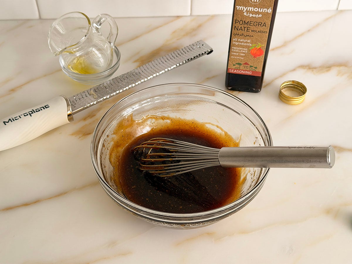 Whisked steak marinade in a glass bowl