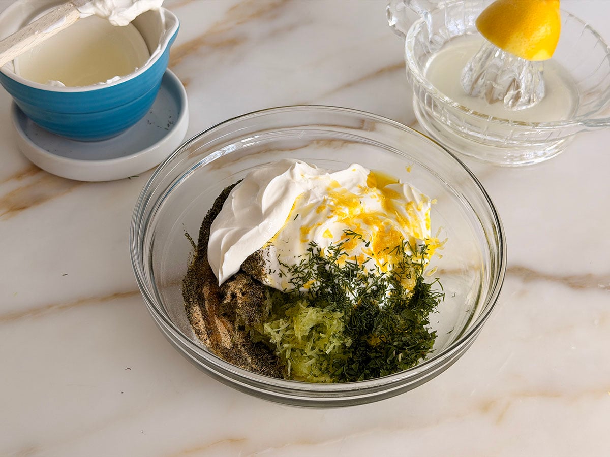 Tzatziki ingredients in a glass bowl